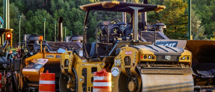 Yellow Road Roller Parked on Side of the Road